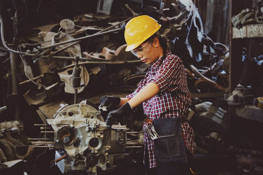 Maintenance technician servicing industrial equipment on site